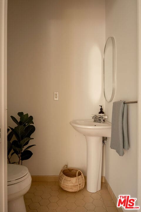 bathroom featuring tile patterned floors and toilet