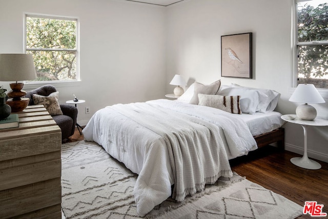 bedroom with hardwood / wood-style flooring