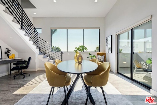 dining area with hardwood / wood-style flooring