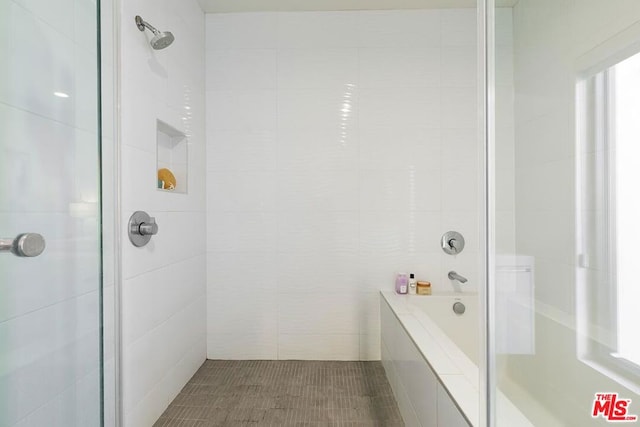 bathroom featuring plus walk in shower