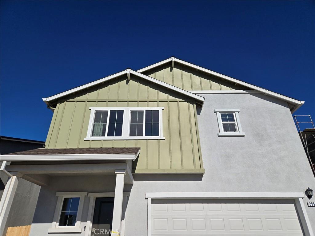 view of side of home with a garage