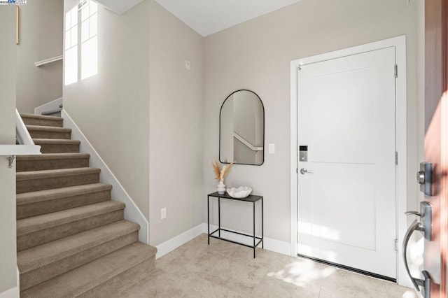 entryway featuring light tile patterned flooring