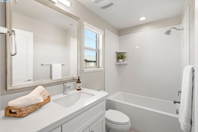 full bathroom featuring vanity, bathing tub / shower combination, and toilet