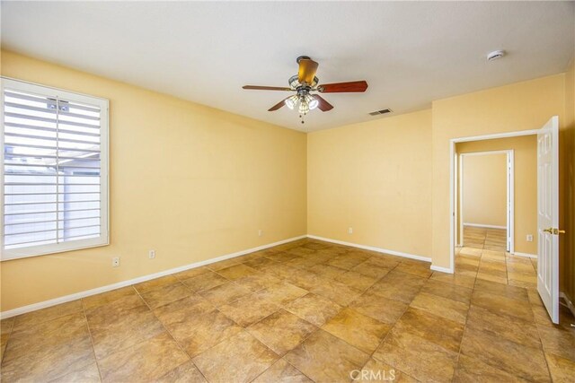 spare room featuring ceiling fan