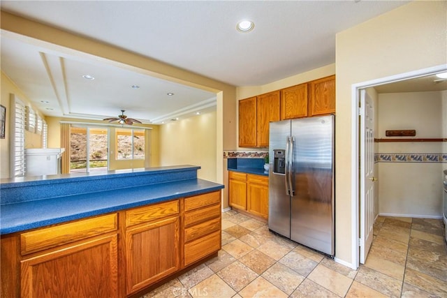 kitchen with stainless steel refrigerator with ice dispenser and ceiling fan