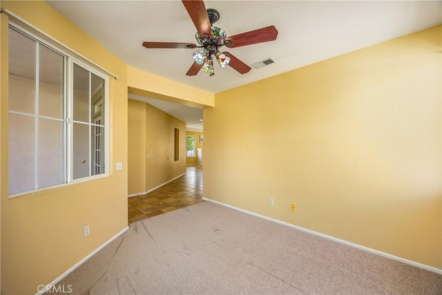 carpeted empty room with ceiling fan