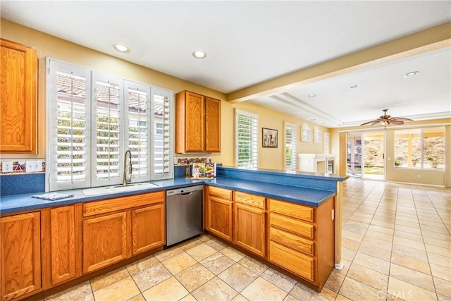 kitchen with ceiling fan, dishwasher, sink, and kitchen peninsula