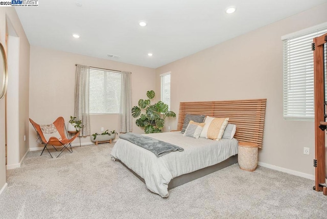 bedroom with light colored carpet