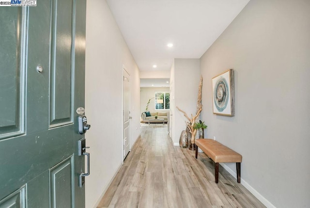 corridor featuring light hardwood / wood-style floors