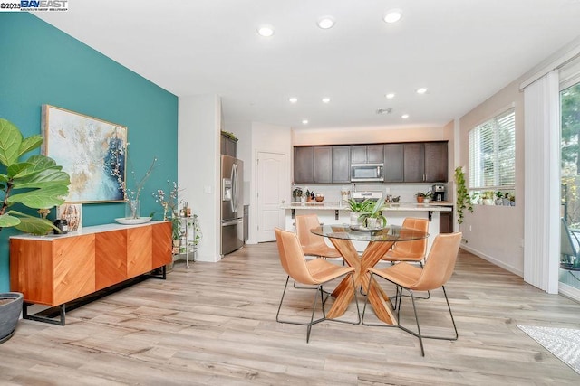 dining area with light hardwood / wood-style floors