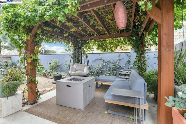 view of patio featuring an outdoor living space with a fire pit