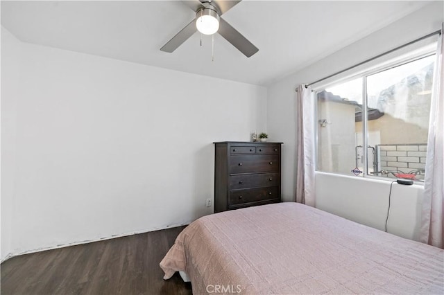 bedroom featuring ceiling fan and dark hardwood / wood-style flooring