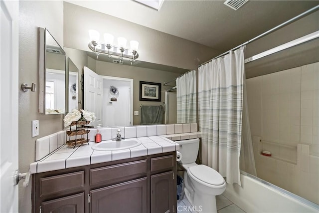 full bathroom featuring tile patterned flooring, vanity, shower / tub combo with curtain, and toilet