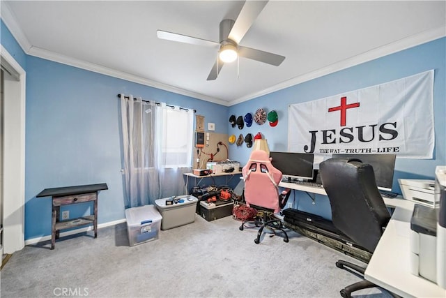 home office with carpet floors, ornamental molding, and ceiling fan