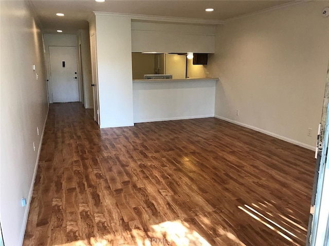 unfurnished living room with crown molding and dark hardwood / wood-style floors