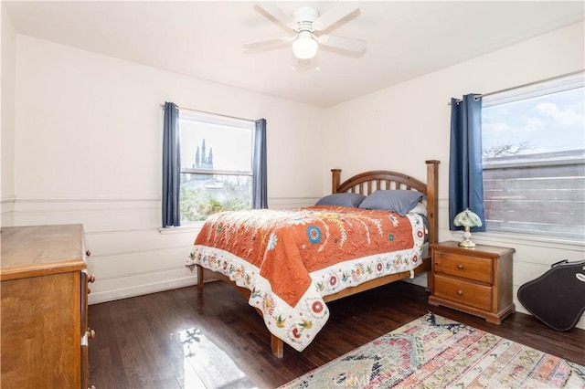 bedroom with ceiling fan and dark hardwood / wood-style floors