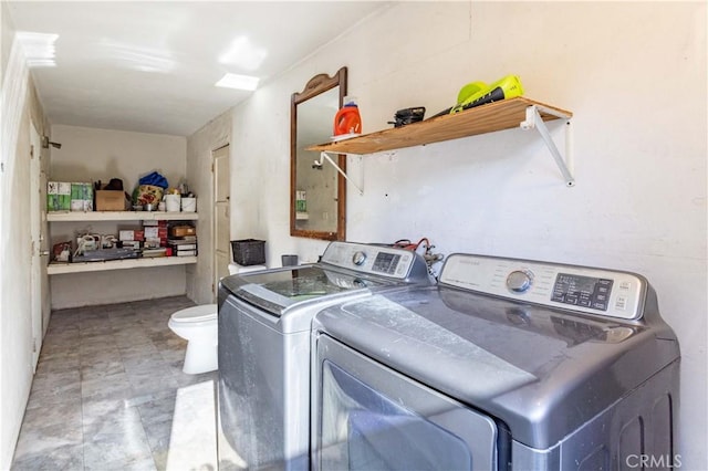 washroom with independent washer and dryer