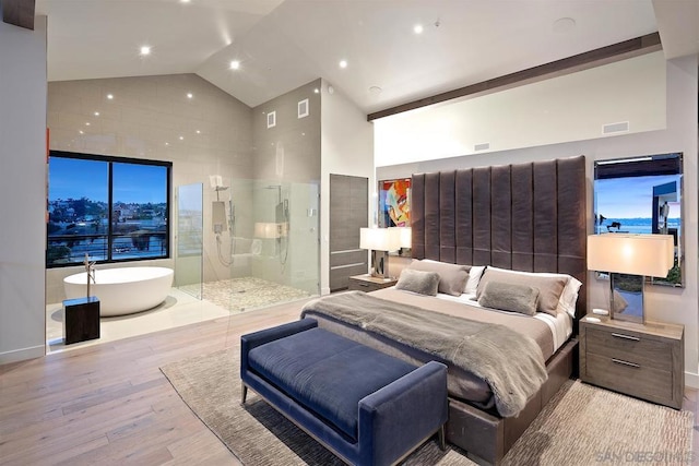 bedroom featuring high vaulted ceiling and light wood-type flooring