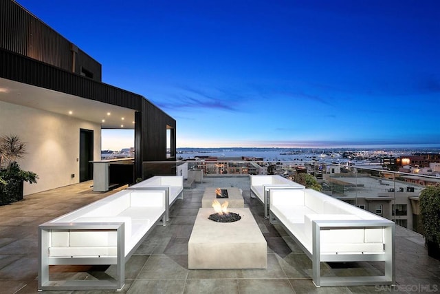 patio terrace at dusk with a fire pit