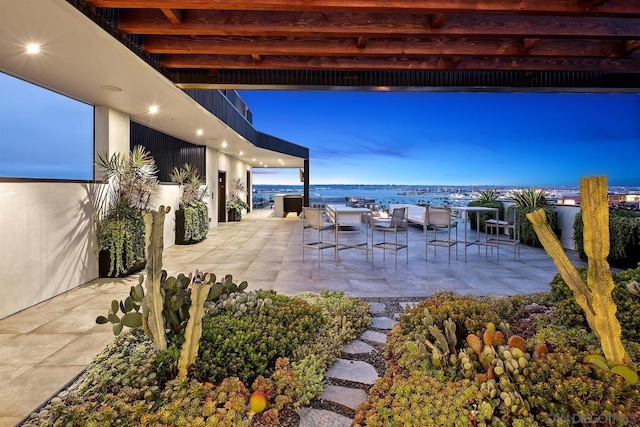 patio terrace at dusk with a water view