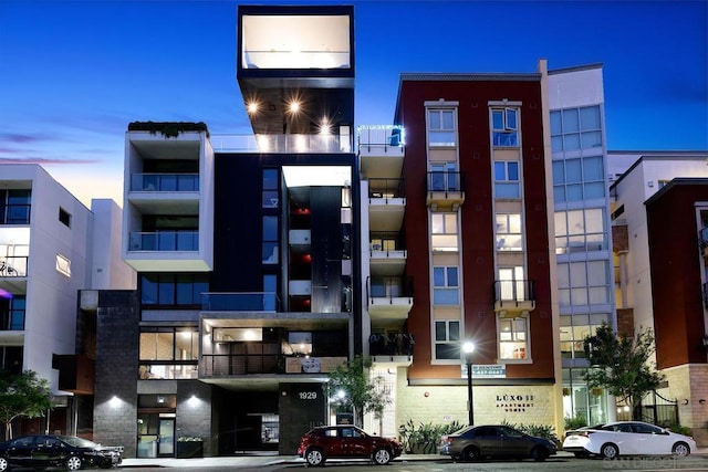 view of outdoor building at dusk