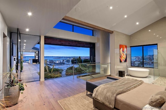 bedroom featuring vaulted ceiling and light hardwood / wood-style floors