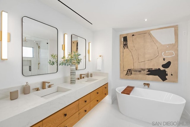 bathroom featuring vanity and separate shower and tub