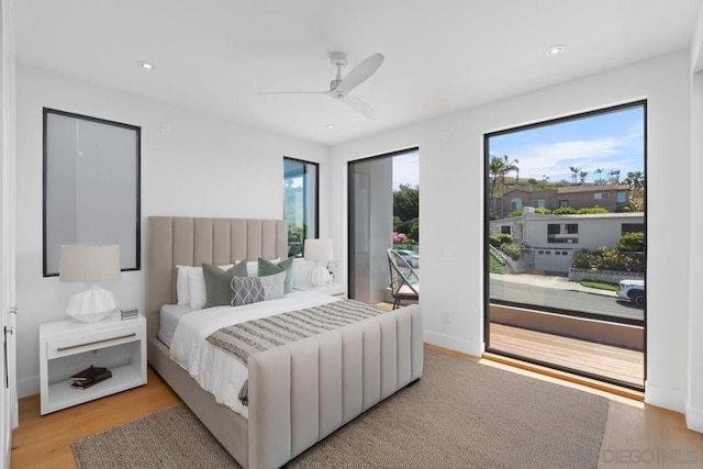 bedroom with access to outside, ceiling fan, and light wood-type flooring