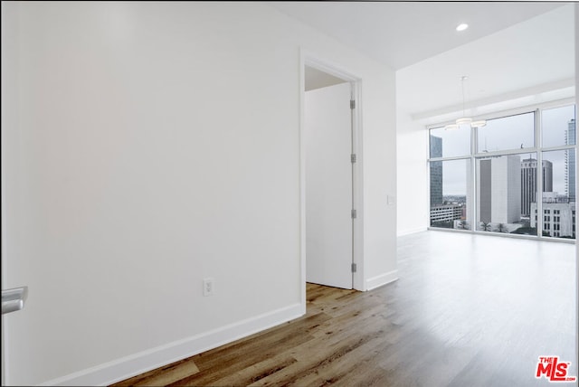 hall with light hardwood / wood-style flooring