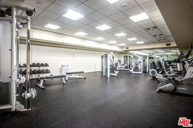 workout area featuring a drop ceiling