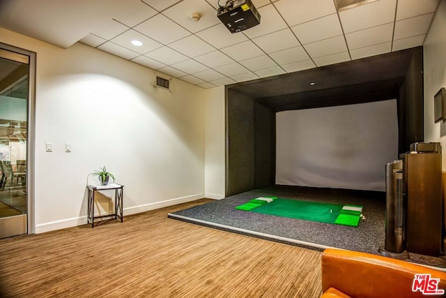 recreation room featuring golf simulator and a drop ceiling