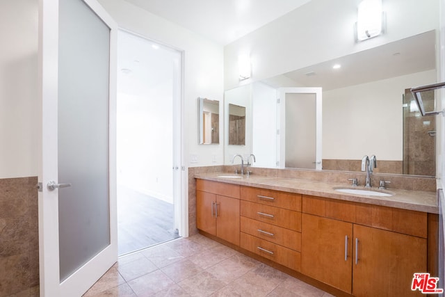 bathroom featuring tile patterned floors and vanity