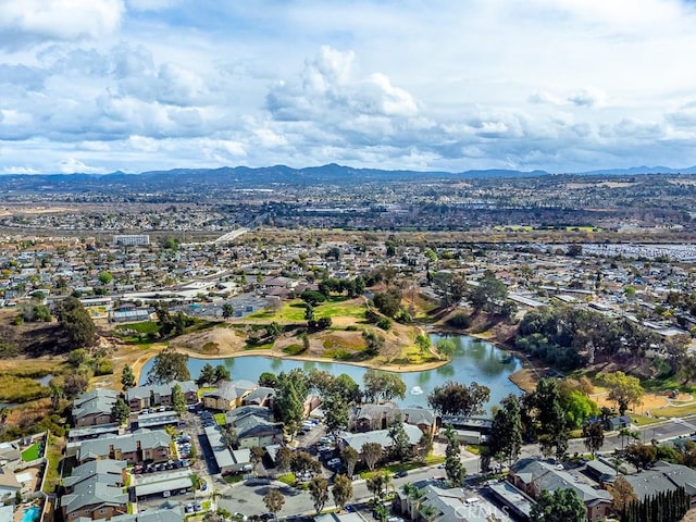 aerial view featuring a water and mountain view