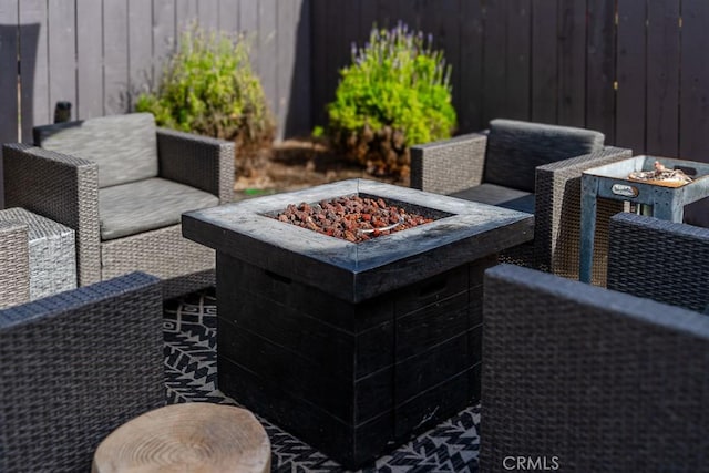 view of patio / terrace with an outdoor fire pit