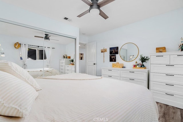 bedroom featuring dark hardwood / wood-style floors and ceiling fan