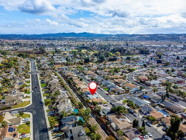 birds eye view of property featuring a mountain view