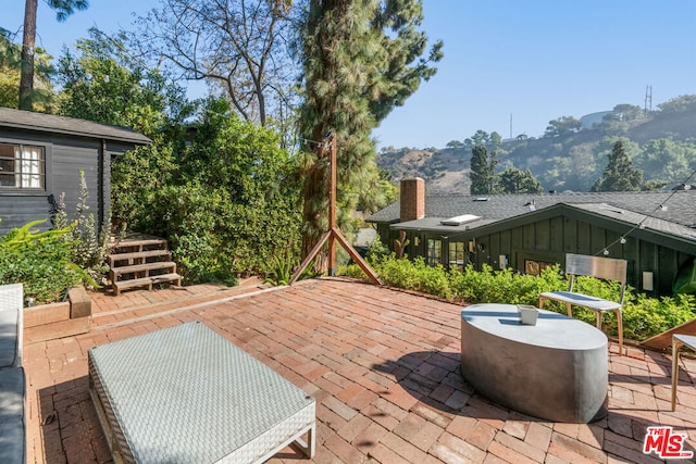 view of patio with a mountain view