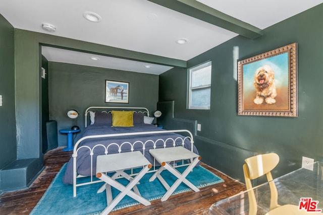 bedroom with dark hardwood / wood-style floors and beamed ceiling