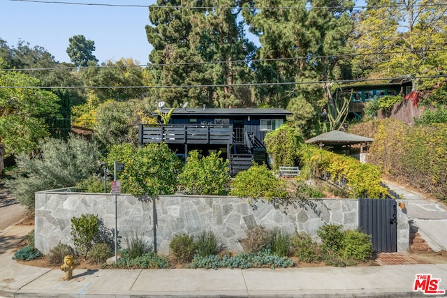 view of front of property featuring a deck