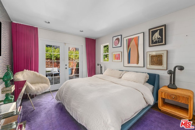 carpeted bedroom featuring access to exterior and french doors