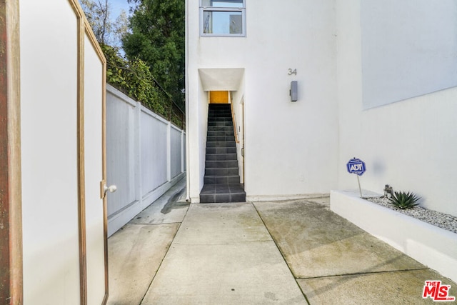 property entrance featuring a patio area