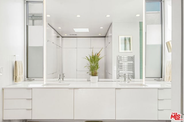 bathroom featuring vanity and radiator heating unit