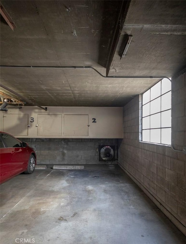 parking deck featuring concrete block wall