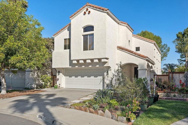 mediterranean / spanish house featuring a garage