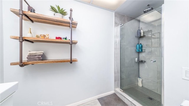 bathroom featuring toilet and walk in shower