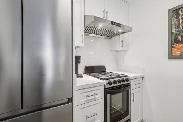 kitchen featuring tasteful backsplash, stainless steel appliances, and white cabinets