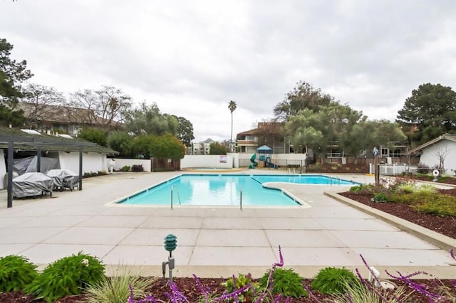 view of swimming pool featuring a patio