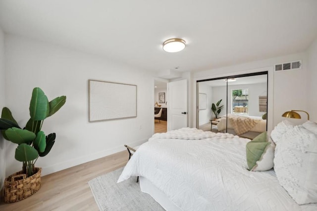 bedroom with a closet and light wood-type flooring