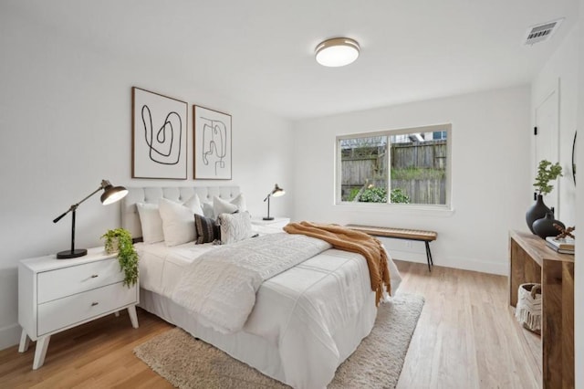 bedroom with light hardwood / wood-style floors