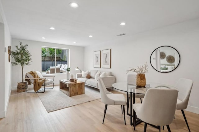 dining room with light hardwood / wood-style flooring